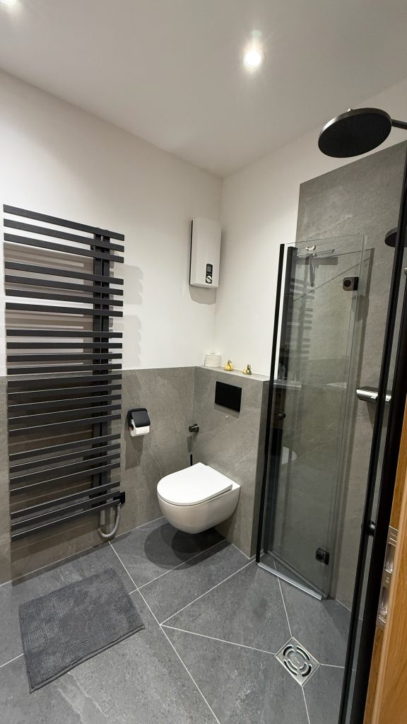 genieten van een regendouche ofwel rainshower en handdoekradiator
